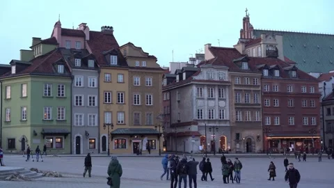 Tourists walking in castle square, old town warsaw at dusk Stock Footage 280700122
