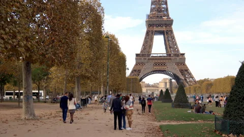Tourists walking on the Champ de Mars on a day of Autumn in Paris, France Stock Footage 222769598