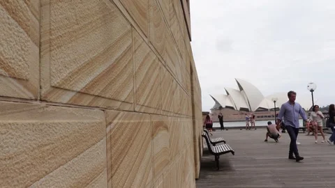 Tourists walking in Circular Quay with Opera house in the background Stock Footage 266432171