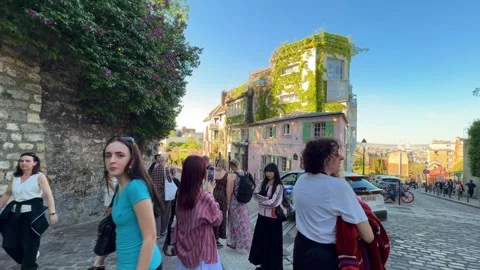 Tourists walking down rue de l'Abreuvoir in Montmartre, Paris Stock Footage 337783808