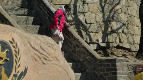 Tourists Walking Down Stone Steps at Mutianyu Great Wall in Beijing, China Stock Footage 345823398
