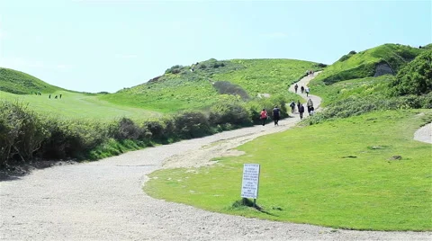 Tourists walking up the hill in Etretat, Normandy, France Stock Footage 49748853