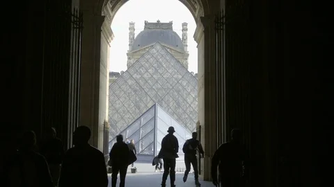 Tourists walking in Le Louvre complex - silhouettes of people slow motion Paris Stock Footage 94066533