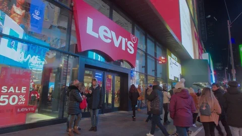 Tourists Walking by Levis Jeans Store in Times Square (NYC) Stock Footage 101308673
