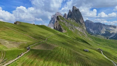 Tourists walking on a mountain path reaching seceda peak Video stock 283298577