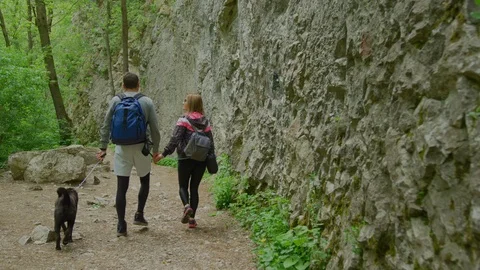Tourists walking on a mountain trail Stock Footage 99962701