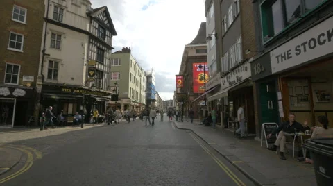 Tourists walking on Old Compton St in London Stock Footage 61390049