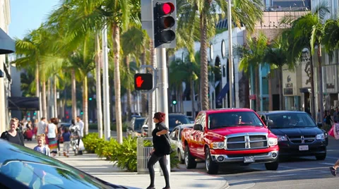 Tourists walking on Rodeo Drive in Beverly Hills, Los Angeles, California Stock Footage 32185157