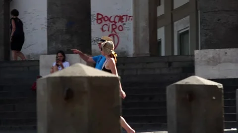 Tourists Walking In A Square Video stock 250559596