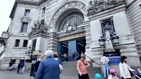 Tourists walking up the steps of Waterloo Station in London Stock Footage 307831321