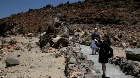 Tourists walking on the Teide Volcano Stock Footage 11337599