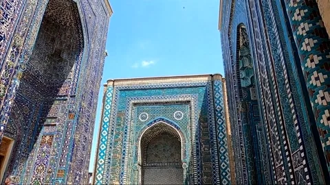 Tourists walking through the ancient blue tile corridor of Shah-i-Zinda Stock-Footage 336807434
