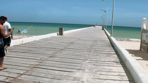 TOURISTS WALKING THROUGH DOCK AT PUERTO PROGRESO LIFE IN MERIDA YUCATAN Stock Footage 100799268