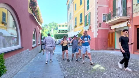 Tourists Walking Through a Narrow Cobblestone Street in Portofino Italy Stock-Footage 336532019