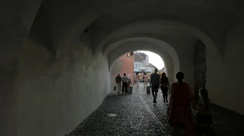 Tourists walking through the passage under the Council Tower, Sibiu Stock Footage 53078061