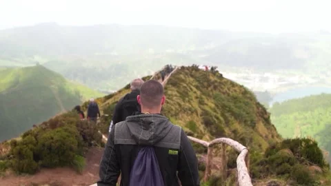 Tourists walking through pathway to hell in Sao Miguel, Azores. Stockbeeldmateriaal 237692186