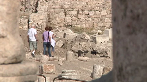 Tourists walking through ruins Stock Footage 58494849