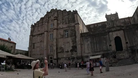 Tourists walking through the streets of the old town of Dubrovnik Stock Footage 255143565