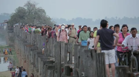 Tourists walking on U Bein Bridge Stock Footage 48733640