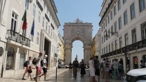 Tourists Walking Under Rua Augusta Arch on Busy Sunny Street in Lisbon, Portugal Stock-Footage 339066931