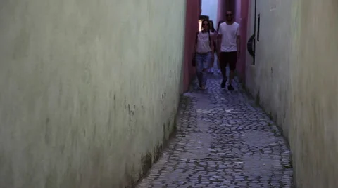 Tourists walking on very narrow old street, Europe, medieval town Stock Footage 40536588