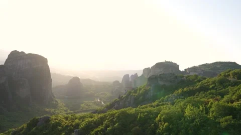 Tourists Watch Sunset at Holy Monastery of Rousanou Meteora Greece. Pan fro.. Stock Footage 334871120