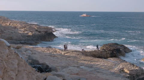 Tourists watching the rough ocean waves in Malta Stock Footage 65397419
