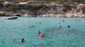 Tourists while swimming in the blue lagoon, village of Latchi, Cyprus HD Footage
