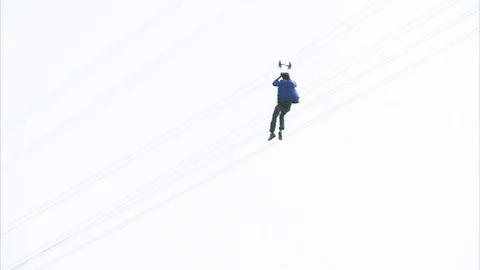 Tourists zip-lining over the river Vídeos de archivo 88337353