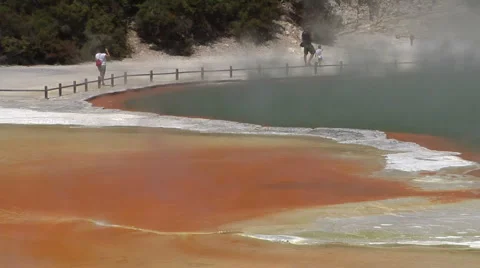Toursit walking by hot geothermal pool Stock Footage 2525138