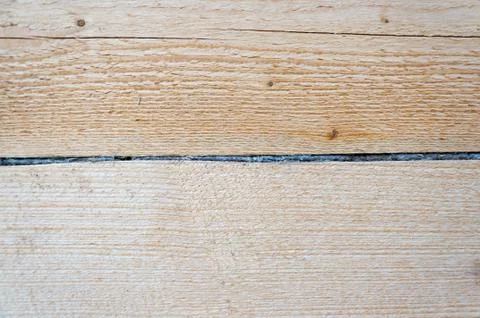 Tow between logs. Close-up. Background. Texture. Wood house. Stock Photos