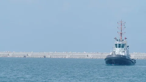 A tow boat sails in the harbor Stock Footage 118591893