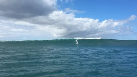 Tow in Surfer riding a giant wave Video stock 124501971