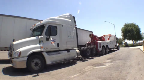 Tow truck and big rig towing Stock Footage 38494341