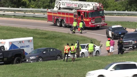 Tow truck police and ambulance at accide... | Stock Video | Pond5