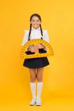 Towards knowledge. happy small school girl study geometry. student use 스톡 사진