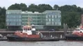 Towboats and bicyclists at Hamburg harbour vehicle shot HD Footage