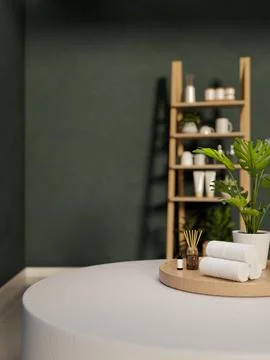 Towel and diffuser with essential oil on tray over table across wooden shel.. Illustrazione stock