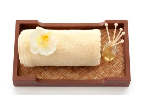 Towel and reed diffuser in a tray Stock Photos