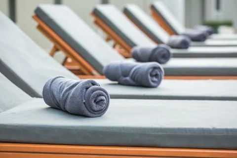 Towel on a canvas bed Stock Photos