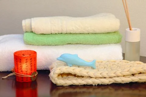 Towel stack with bast and dolphin form soap. Stock-Fotos