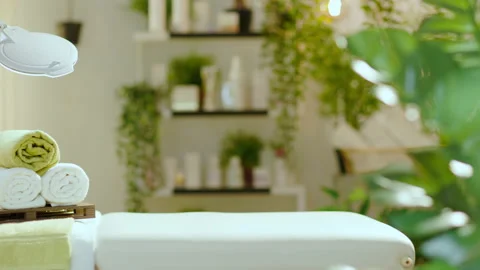 Towels and massage table in modern beauty salon Stock Footage 157684979