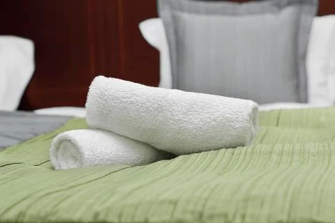 Towels on bed Stock Photos