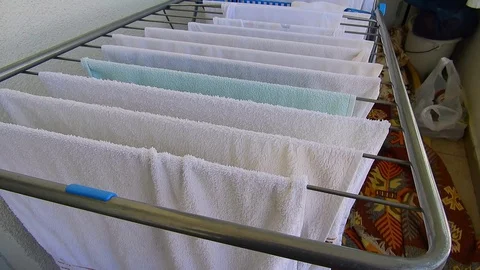 Towels drying on the balcony, laundry drying outside, 스톡 동영상 129339238