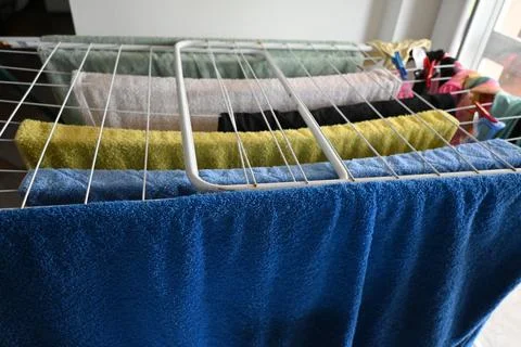 Towels hanging on a drying rack 库存照片