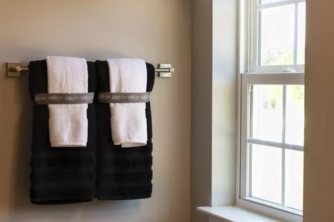 Towels on Rack by Bathroom Window Stock Photos