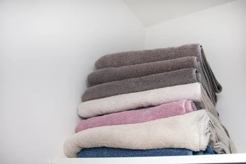 Towels on a shelf Stock Photos