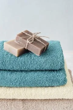 Towels with soap bars Stock Photos
