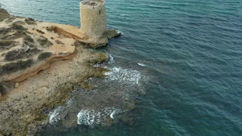 Tower of Abbacurrente, Sardinia, Tilt-Up Drone clip, Round Tower by the Sea 4K  Stock Footage 196270041