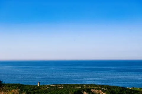 Tower and green cliffs Stock Photos